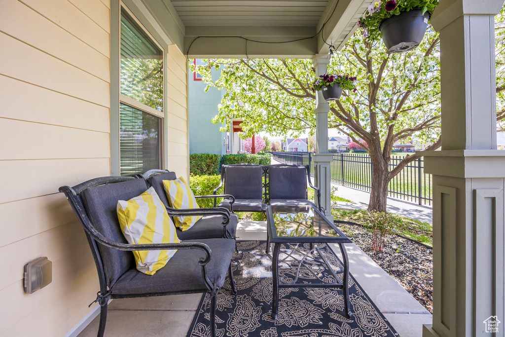 View of patio / terrace featuring fence and an outdoor hangout area