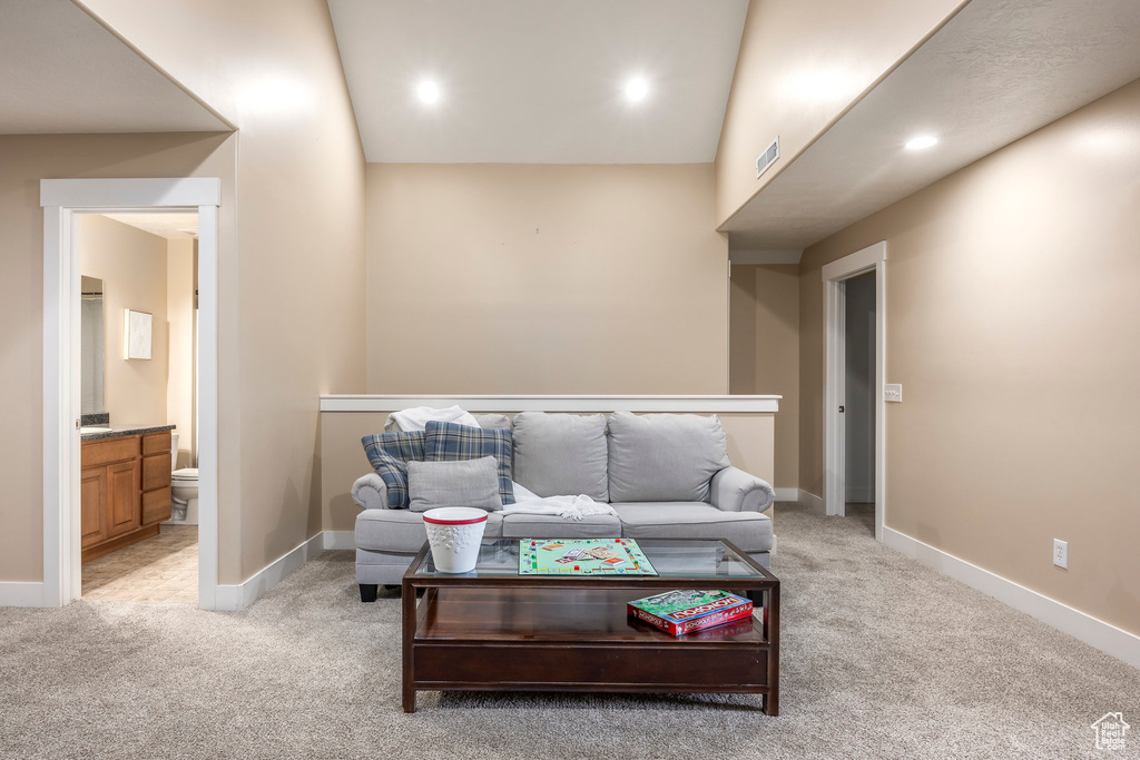 Living room featuring visible vents, recessed lighting, baseboards, and light colored carpet