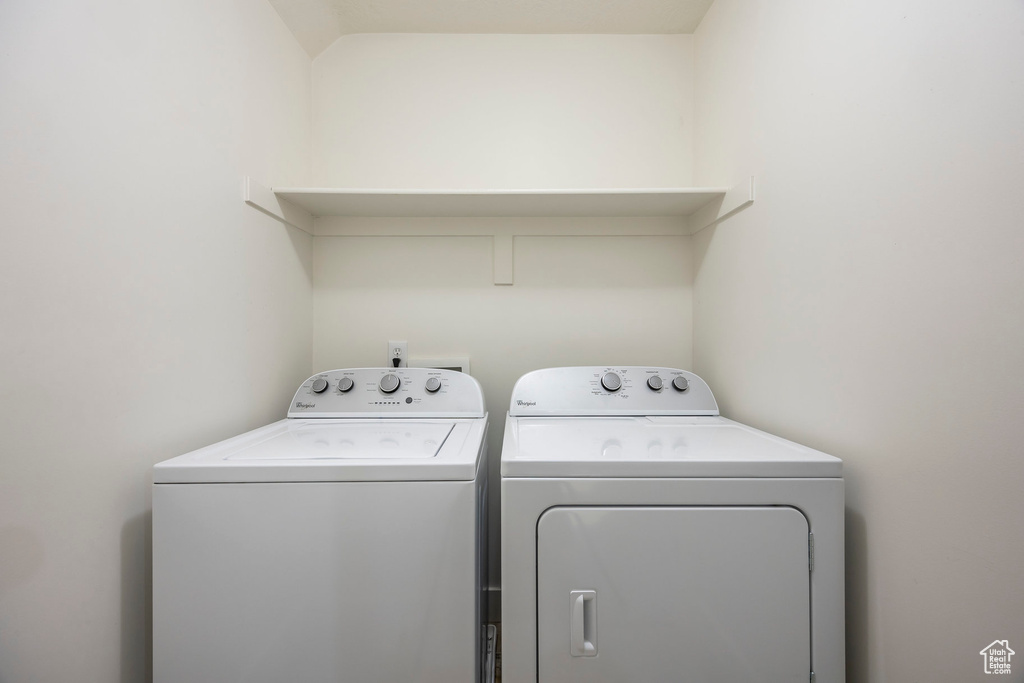 Laundry room featuring laundry area and washing machine and clothes dryer