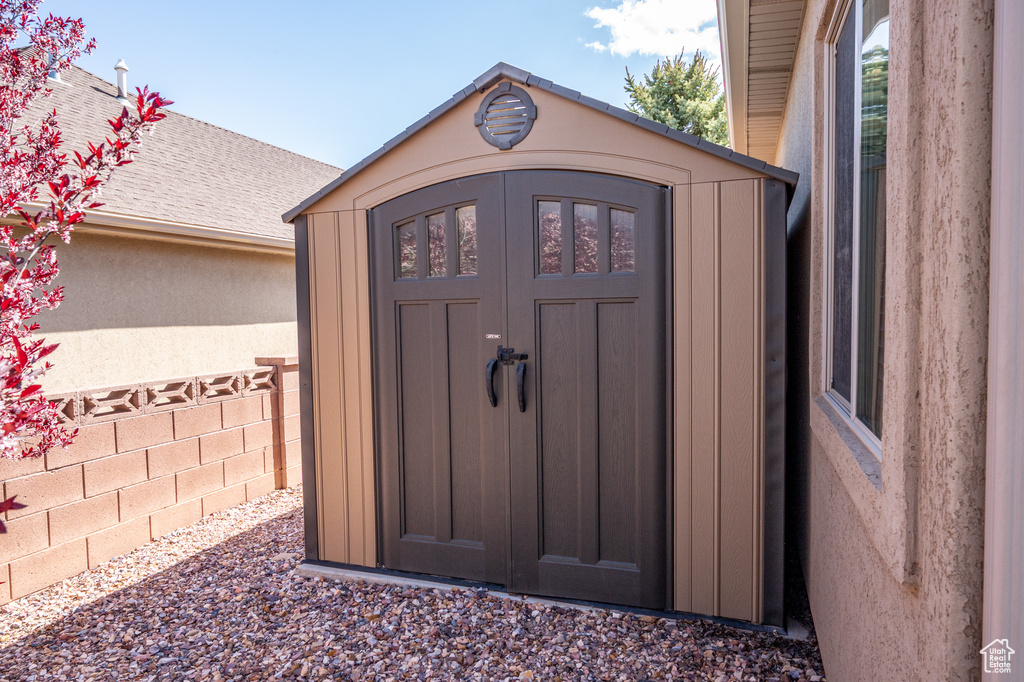 View of shed with fence