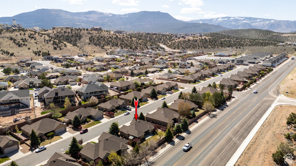 Drone / aerial view with a residential view and a mountain view
