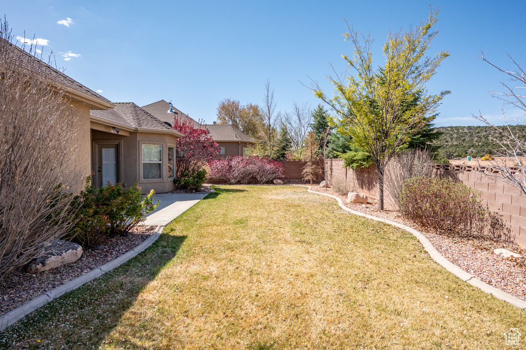 View of yard with a fenced backyard