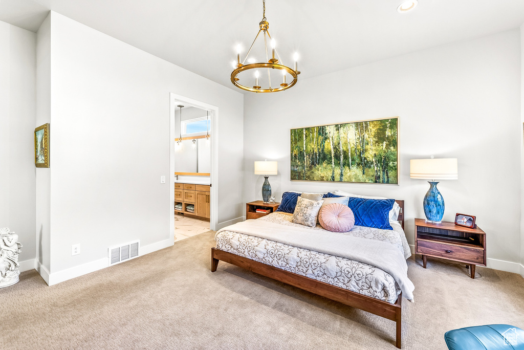 Carpeted bedroom featuring connected bathroom, a notable chandelier, recessed lighting, baseboards, and visible vents