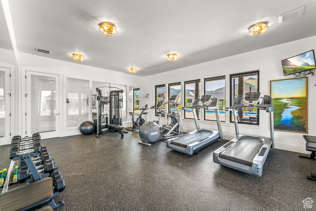 Workout area with baseboards and visible vents