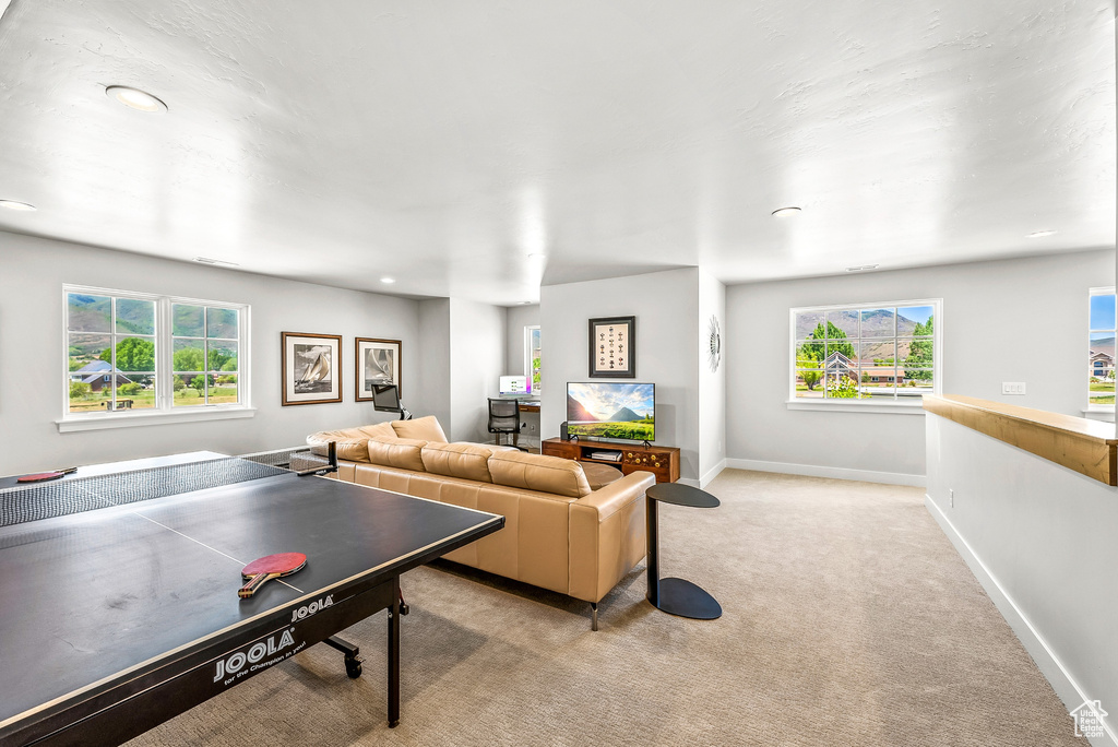 Rec room with light colored carpet, recessed lighting, and baseboards