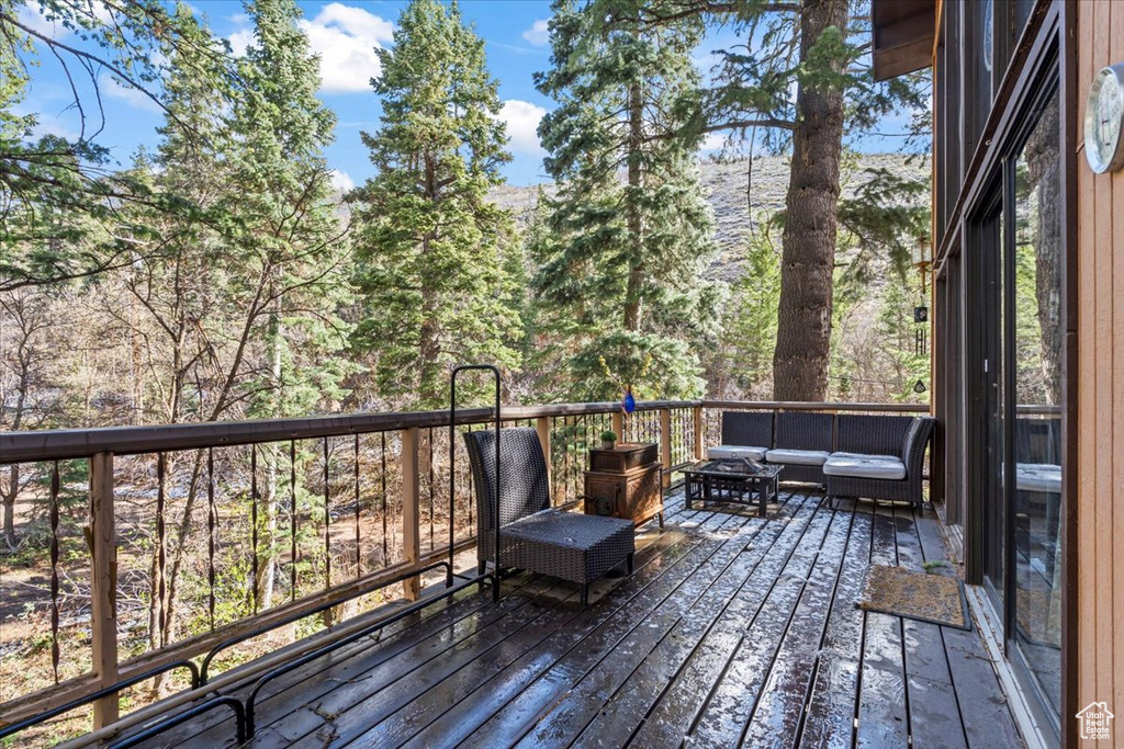 Wooden deck featuring an outdoor hangout area