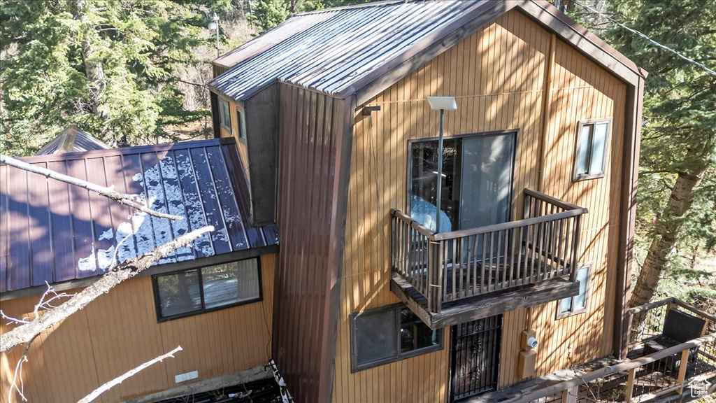 View of side of home with a balcony