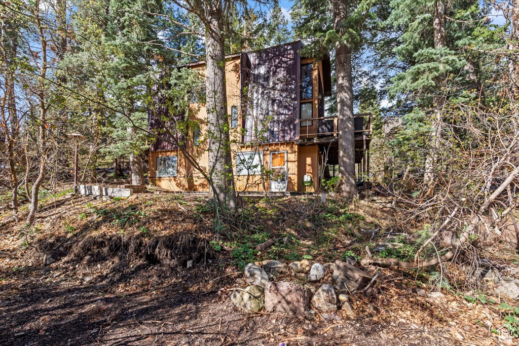 Back of property featuring a deck