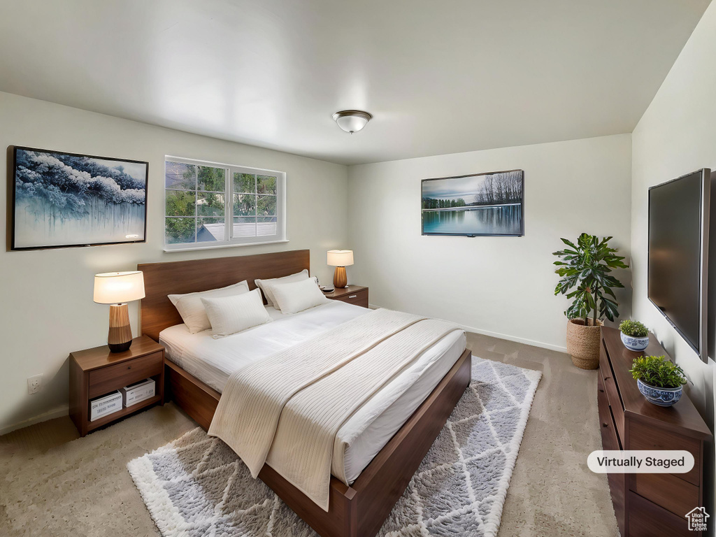 Carpeted bedroom with baseboards