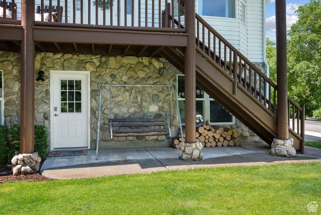 Entrance to property with stone siding