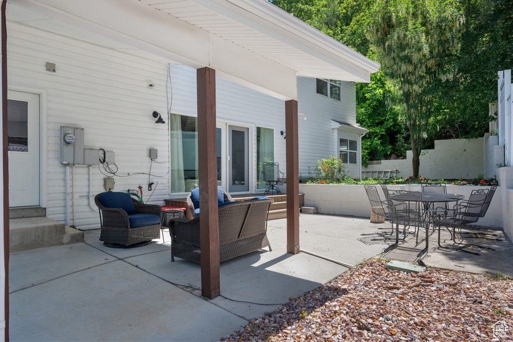 View of patio with outdoor lounge area and outdoor dining space