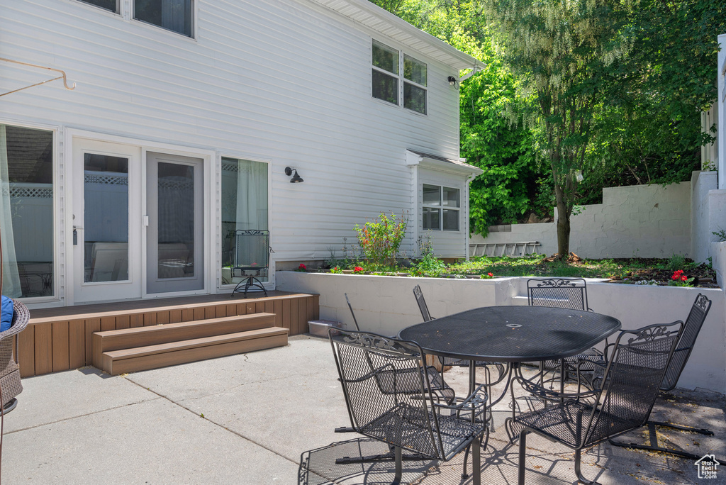 View of patio with outdoor dining area