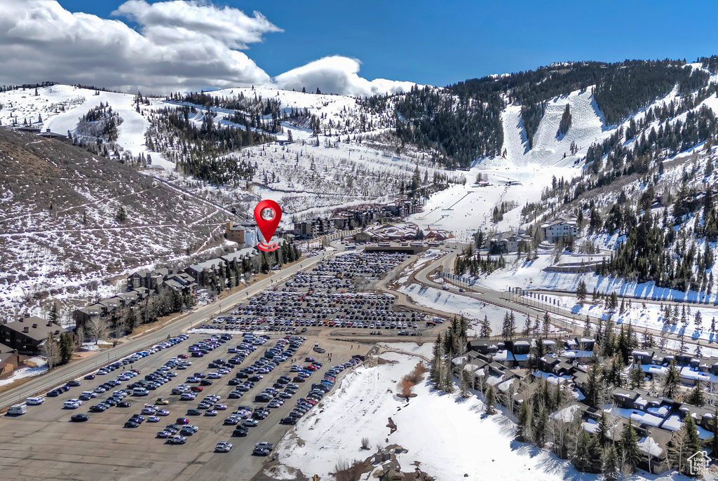 Snowy aerial view featuring a mountain view