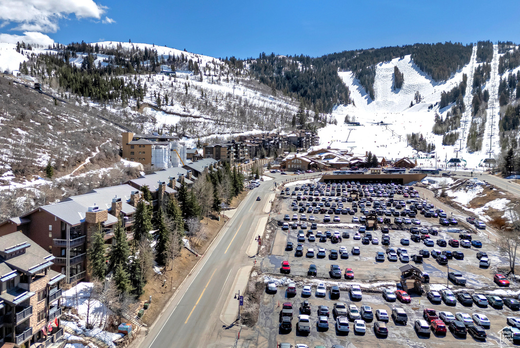 Snowy aerial view featuring a mountain view
