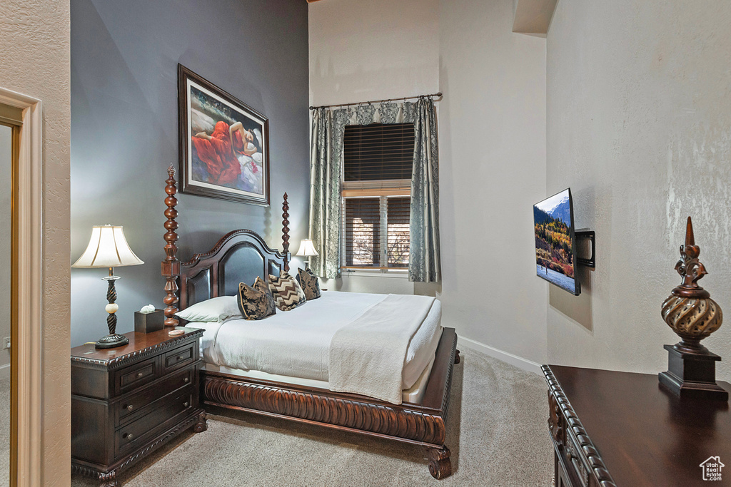Bedroom with baseboards and carpet floors