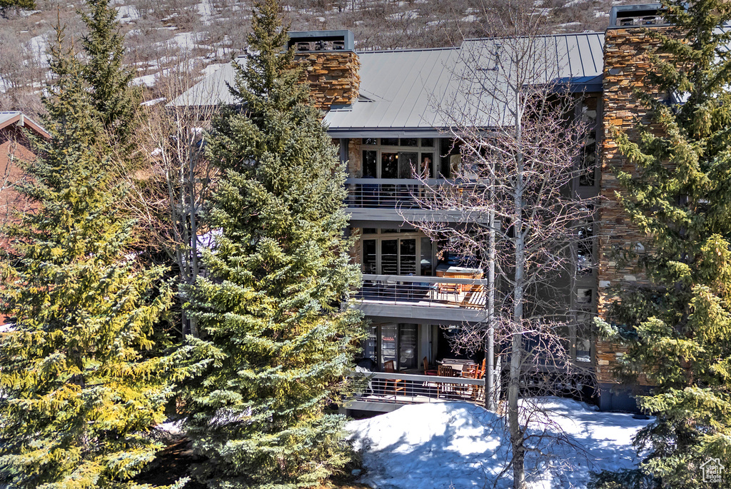 View of front of property with a balcony