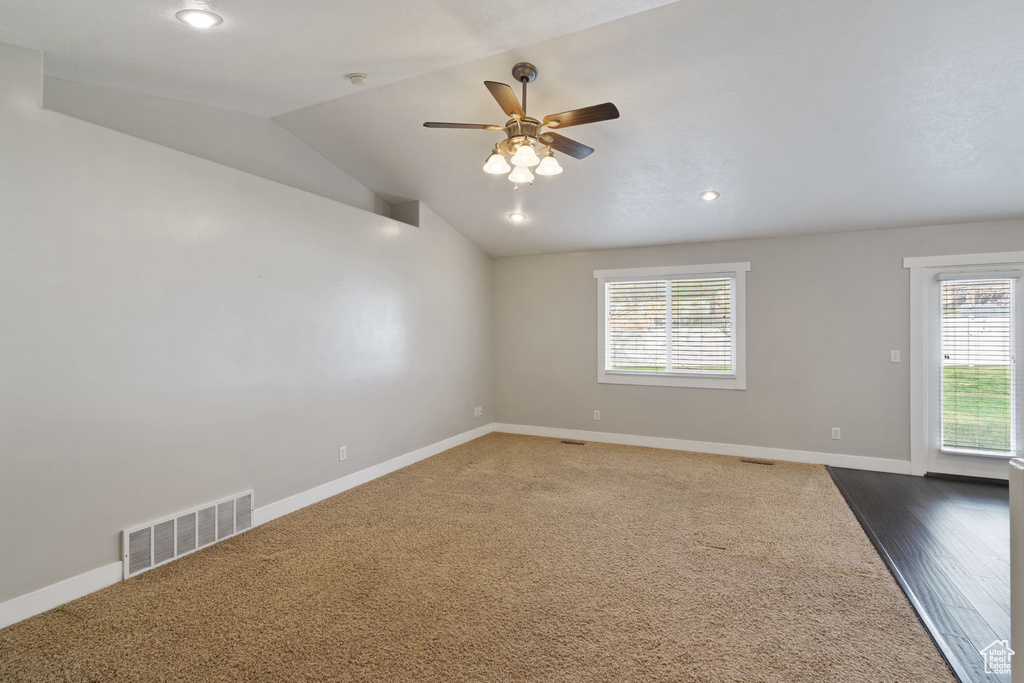 Spare room featuring baseboards, visible vents, and ceiling fan