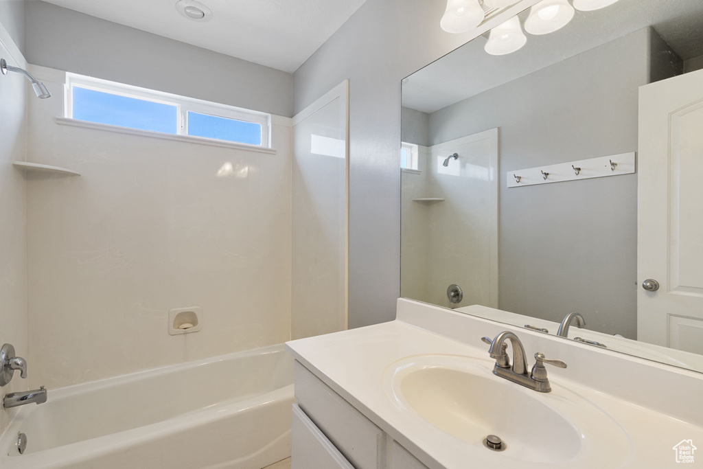 Bathroom featuring bathing tub / shower combination and vanity