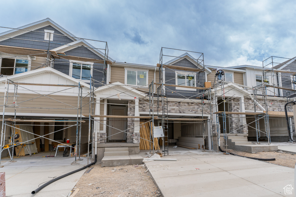 Property under construction featuring stone siding