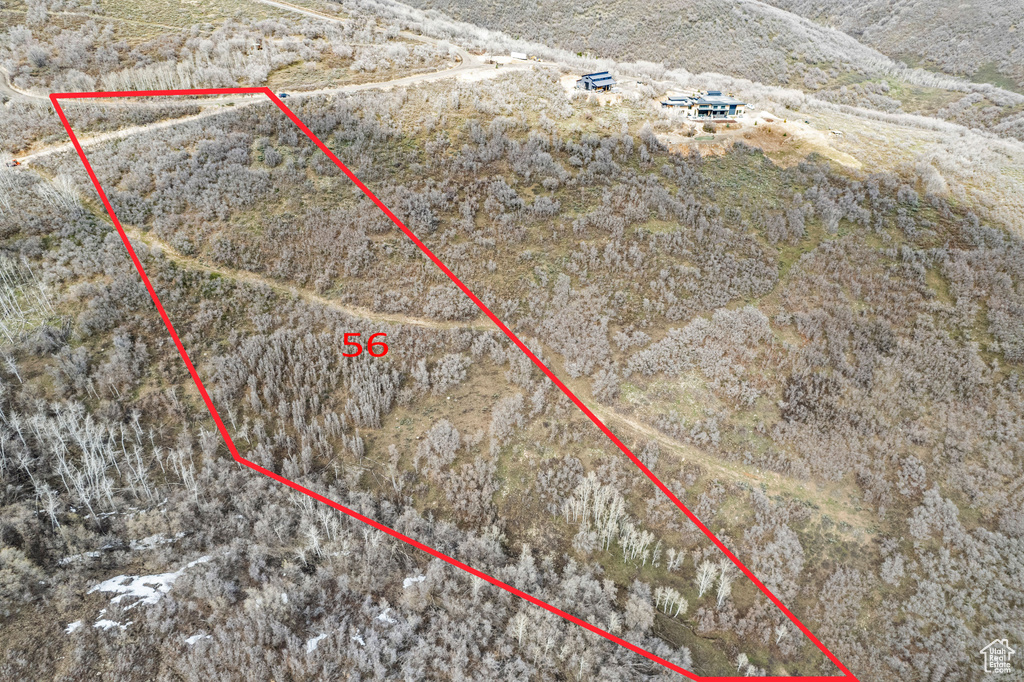 Birds eye view of property with a rural view
