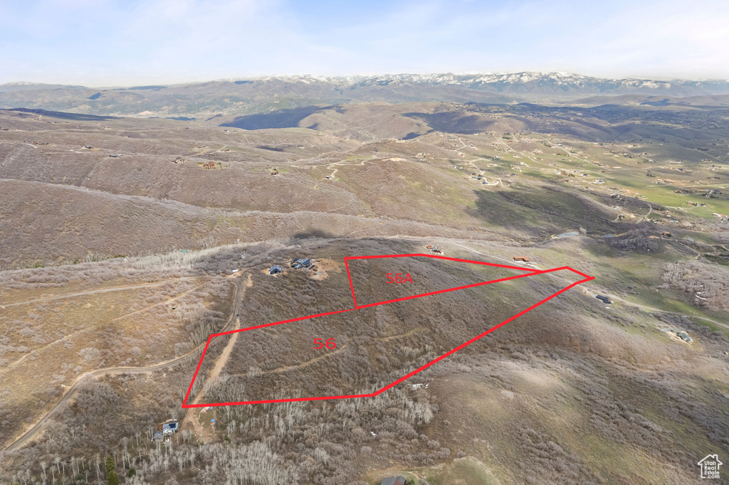 Birds eye view of property with a mountain view and a rural view
