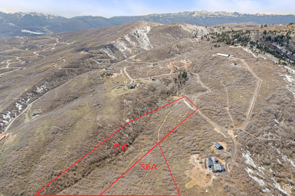 Birds eye view of property with a rural view and a mountain view