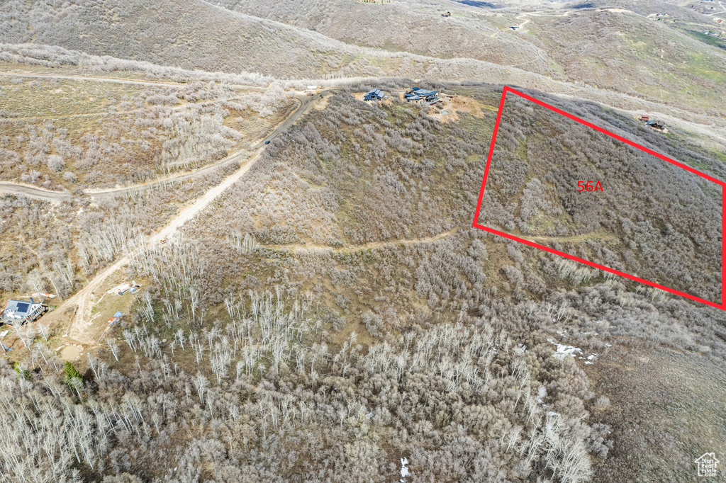 Birds eye view of property with a rural view