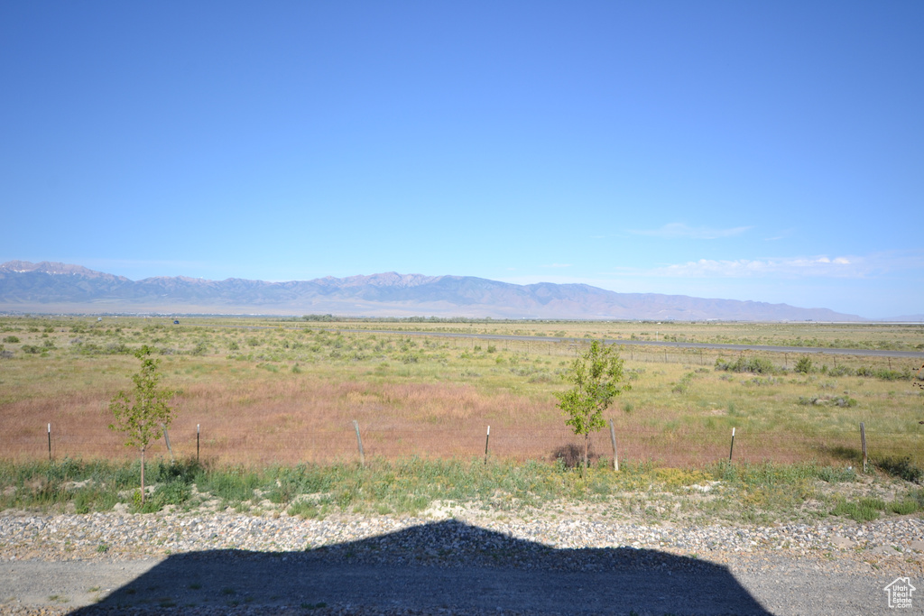 View of mountain background featuring rural landscape