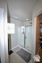 Full bathroom with a shower stall