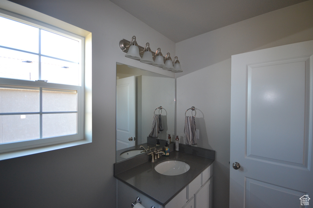 Bathroom featuring vanity and plenty of natural light