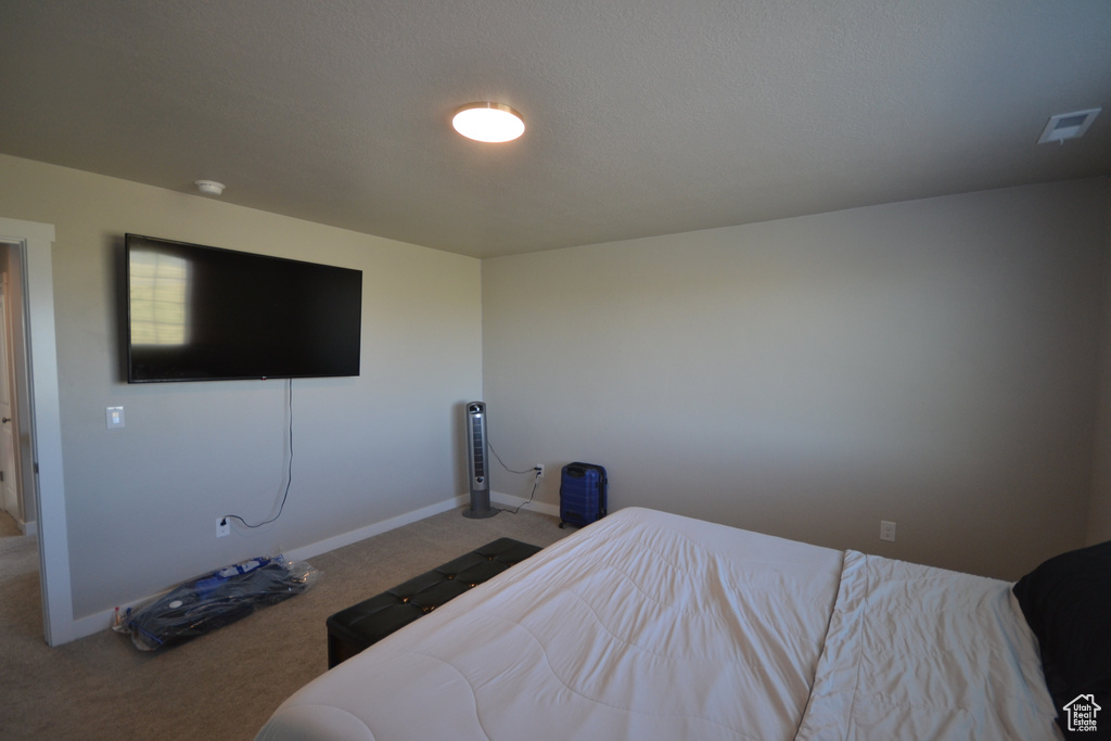 Bedroom with carpet and baseboards