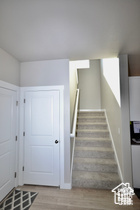 Staircase featuring wood finished floors