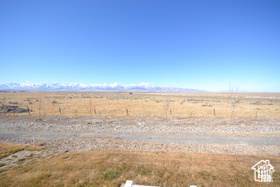 Exterior space with a desert view, a mountain view, and a rural view