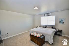 Carpeted bedroom with baseboards