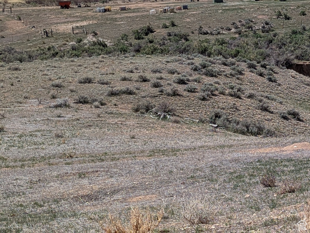 Property view of mountains with a rural view