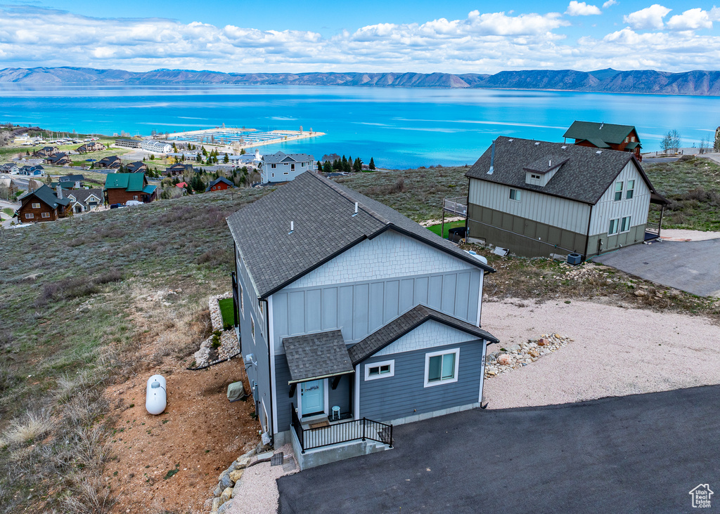 Aerial view featuring a water and mountain view