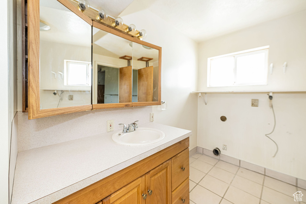 Bathroom featuring vanity and tile patterned flooring