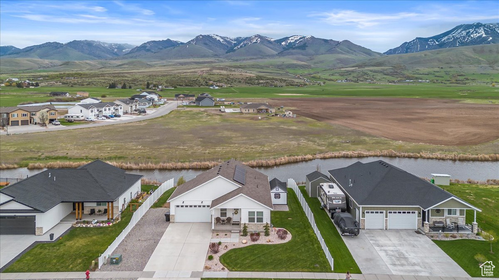 Aerial view featuring a water and mountain view