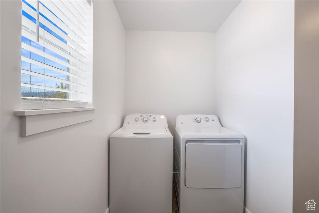 Washroom with separate washer and dryer and laundry area