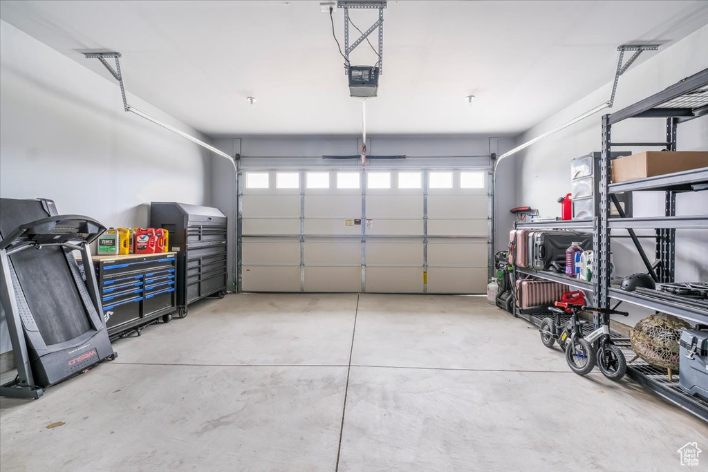 Garage featuring a garage door opener