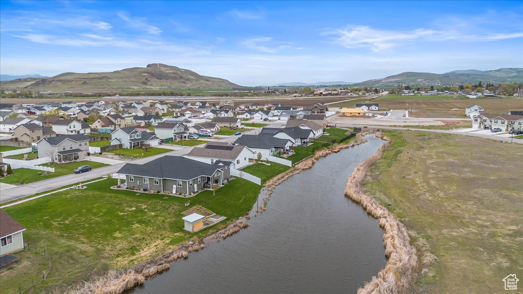 Birds eye view of property featuring a residential view and a water and mountain view