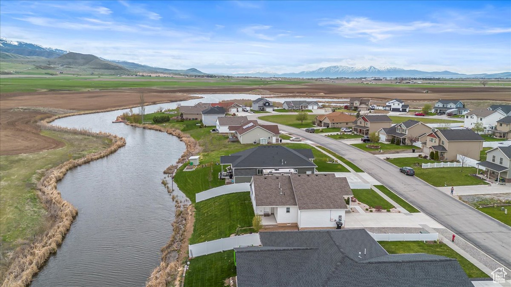 Drone / aerial view featuring a residential view and a water and mountain view