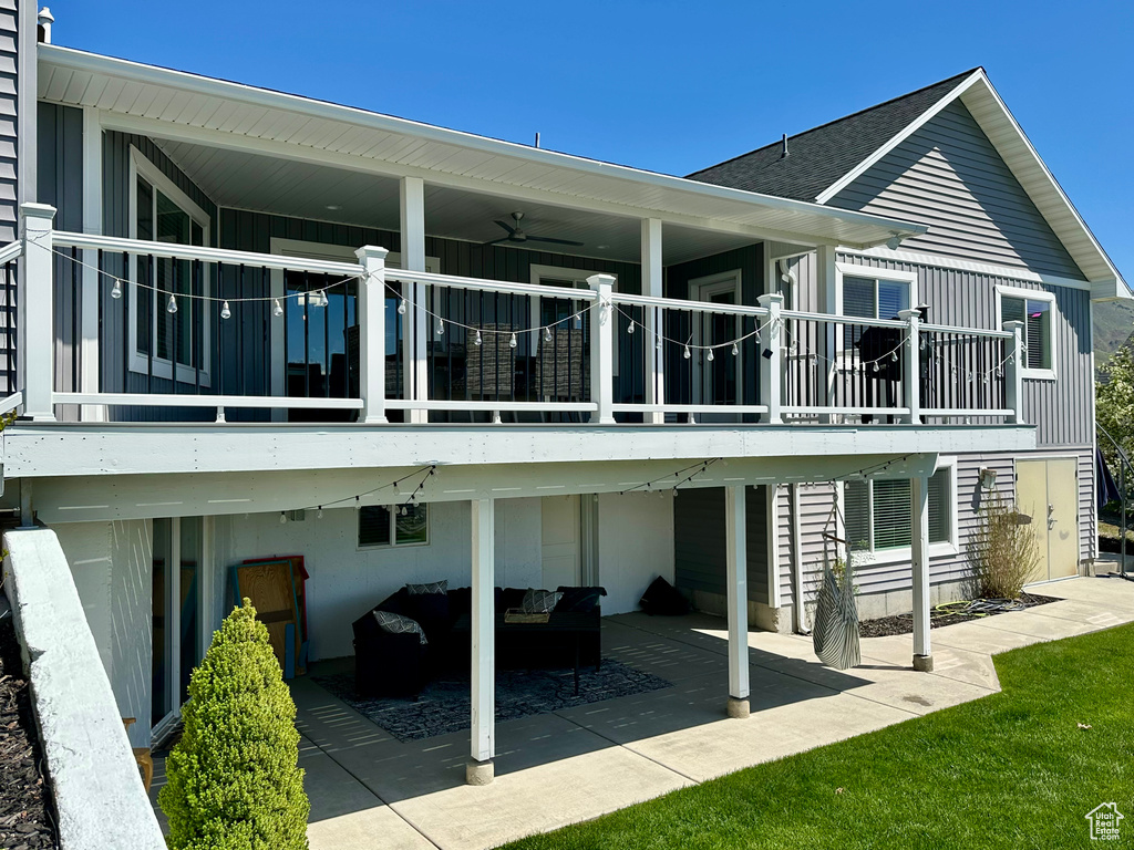 Rear view of property featuring roof with shingles, an outdoor hangout area, a patio, and ceiling fan