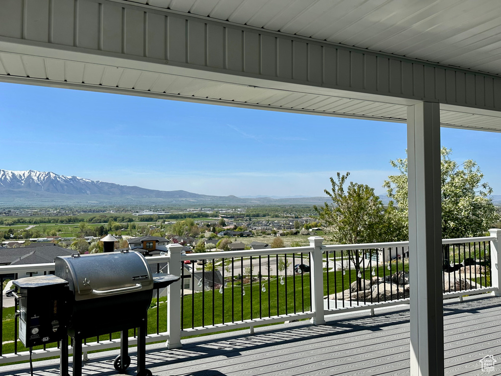 Balcony featuring a mountain view and a grill