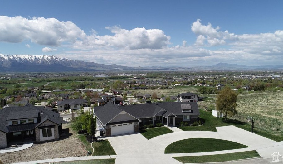 Drone / aerial view featuring a mountain view and a residential view