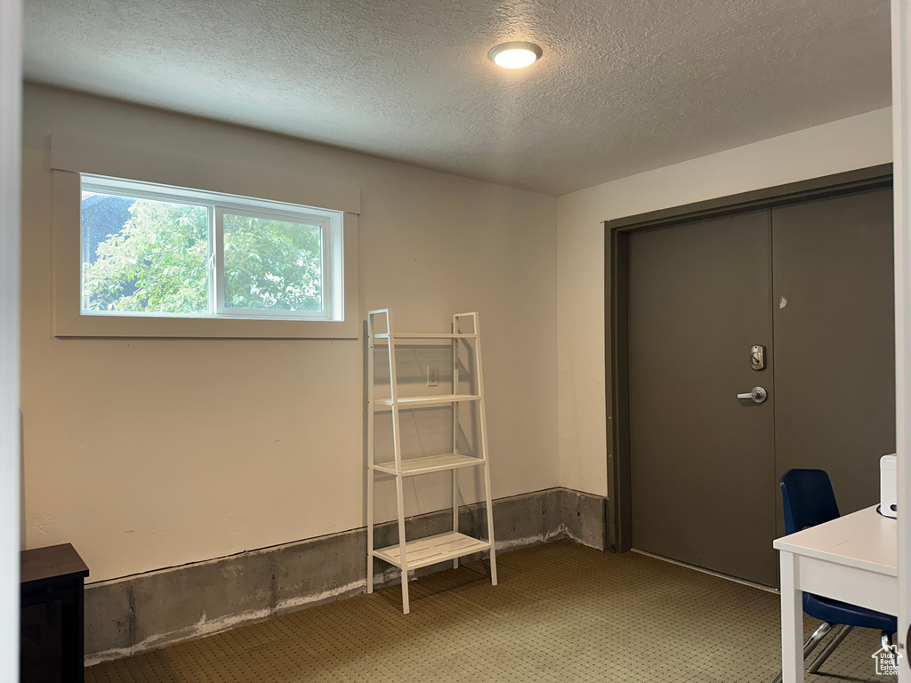 Office featuring a textured ceiling
