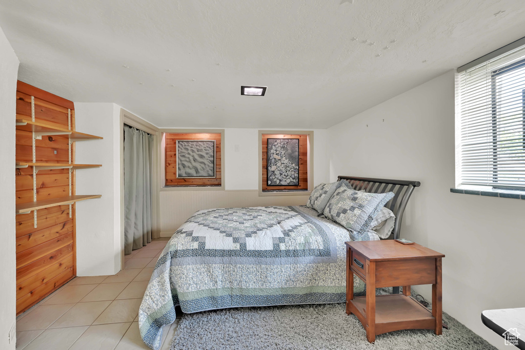 Bedroom featuring light tile patterned flooring
