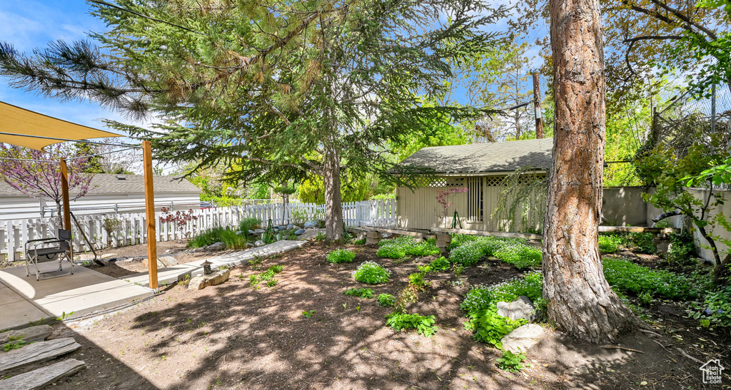 View of yard featuring a fenced backyard and a patio area