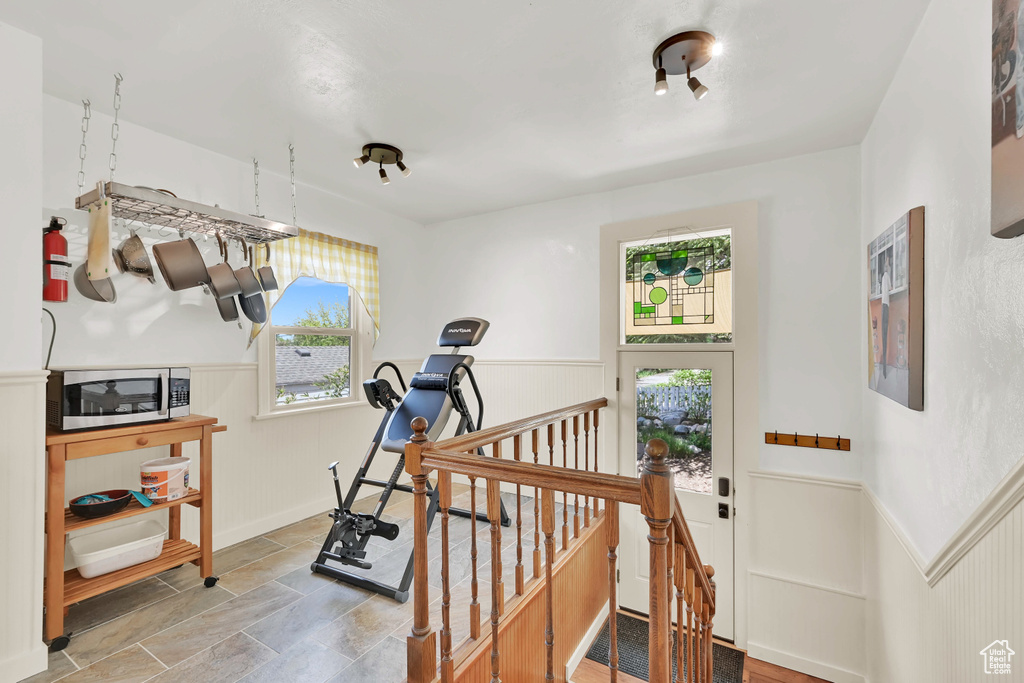 Exercise area with stone finish flooring and wainscoting