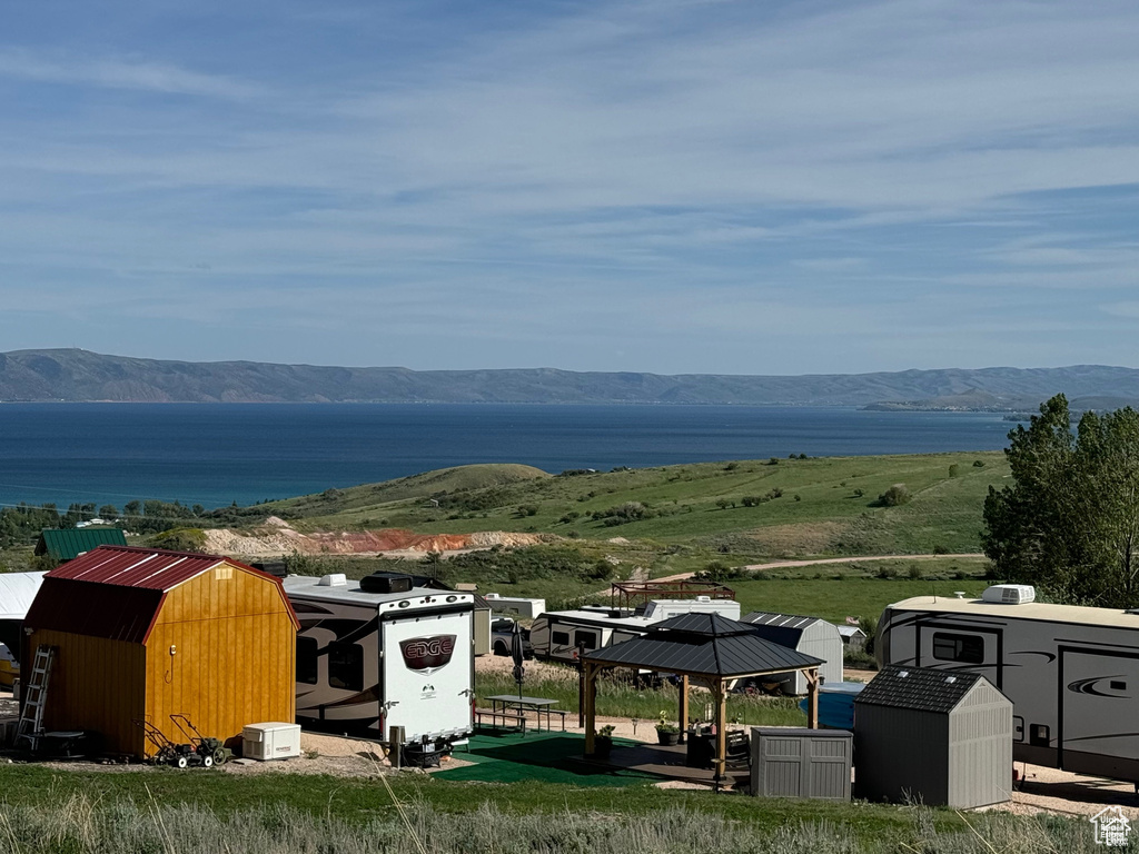 Property view of mountains featuring a water view